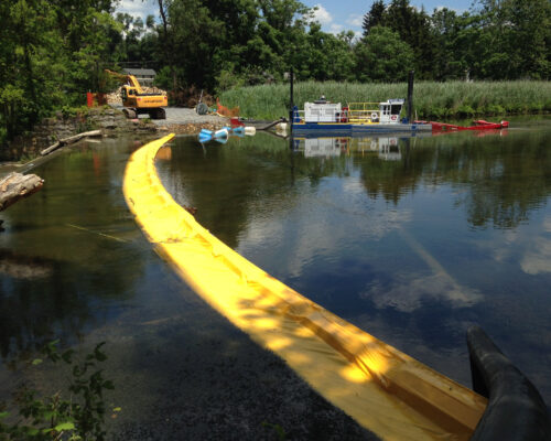 Preparations for the first phase of removal of the Hughesville Dam on the Musconetcong River – dredging the sediment backed up behind the dam. Photo by Katie Conrad/USFWS